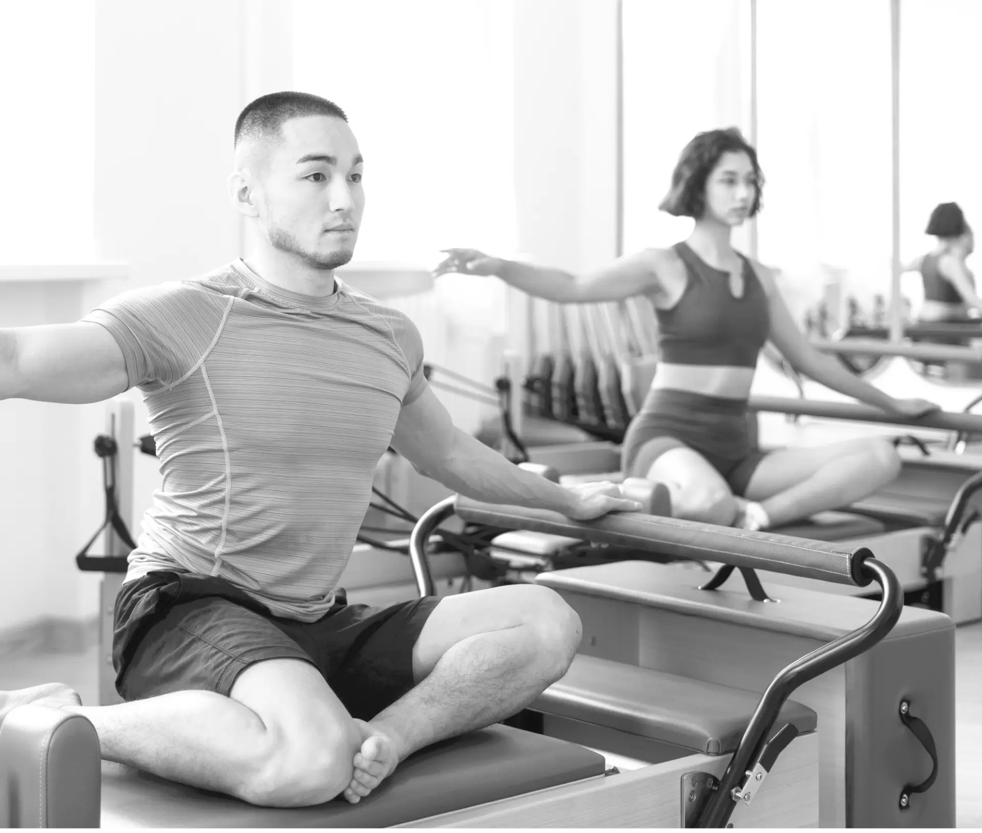 Clients training on reformers during a group class at Valley Studio